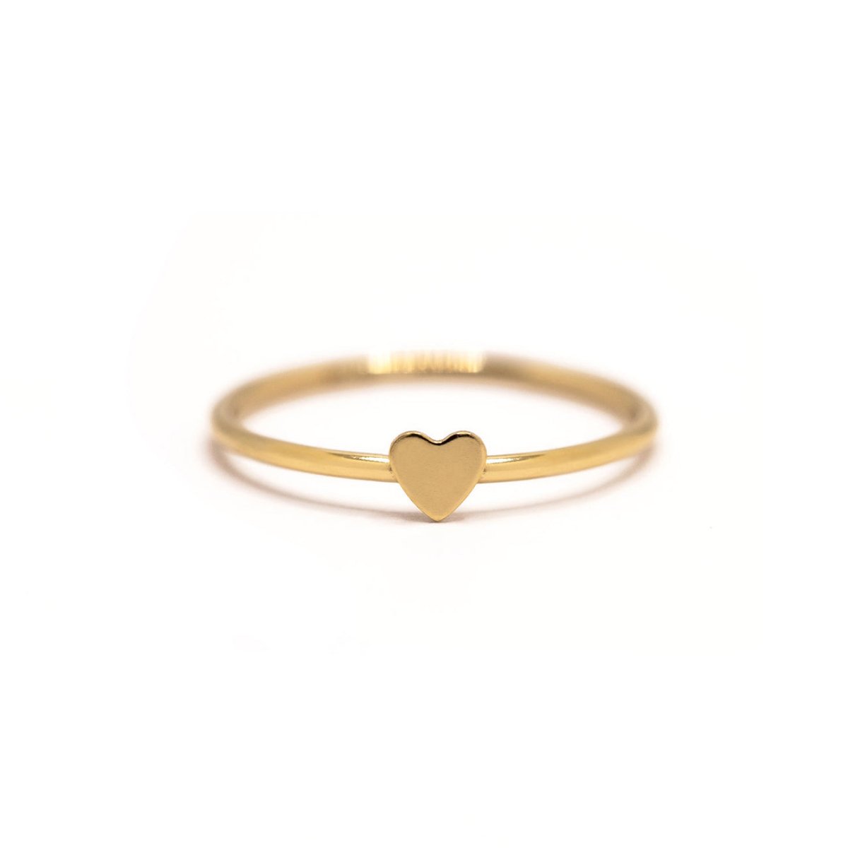 Gold-filled thin band ring with a small plain heart, on a white background