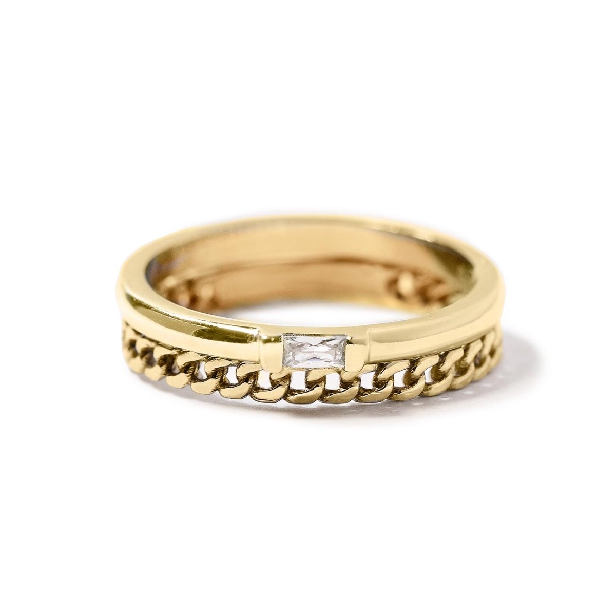 Gold vermeil ring with a curb chain band and a baguette white zirconia stone, on a white background