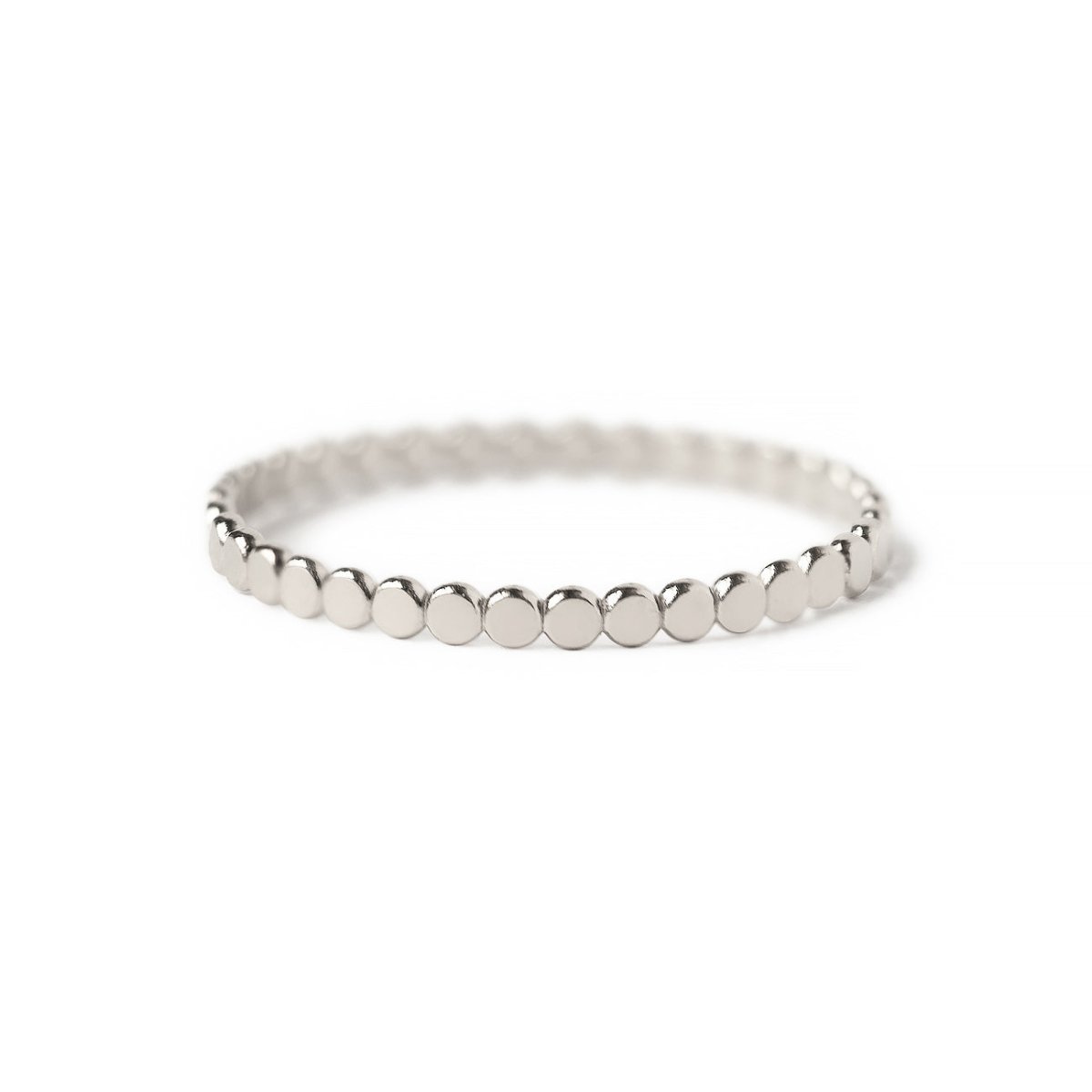 Sterling silver flat beaded band ring, on a white background