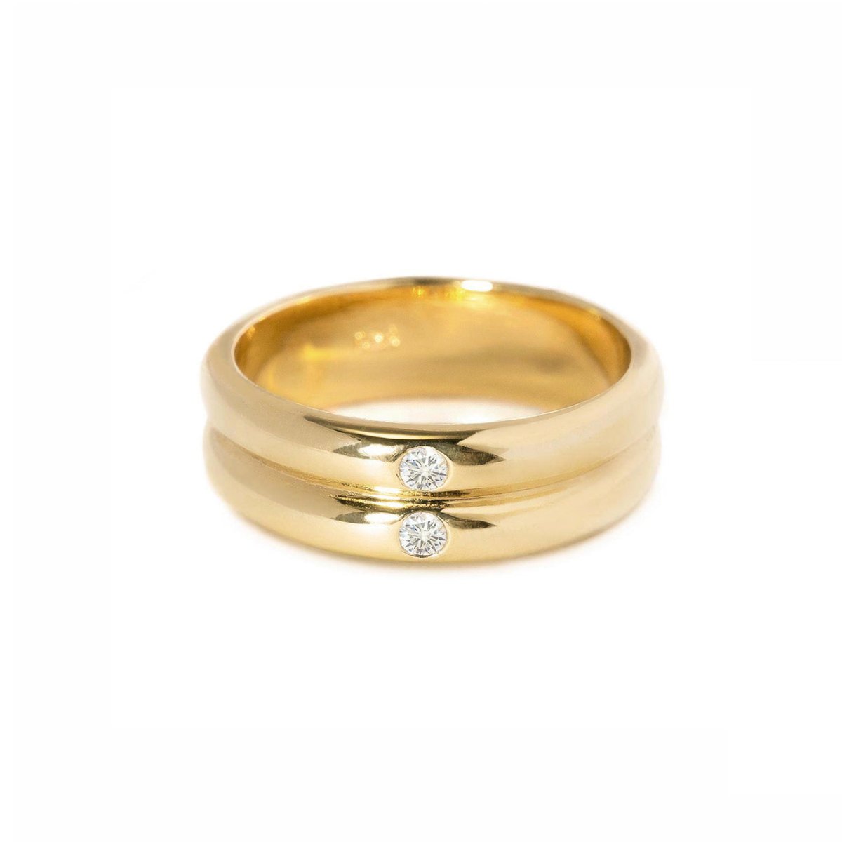 Gold vermeil double-band ring with two round white zirconia stones set between the bands, on a white background