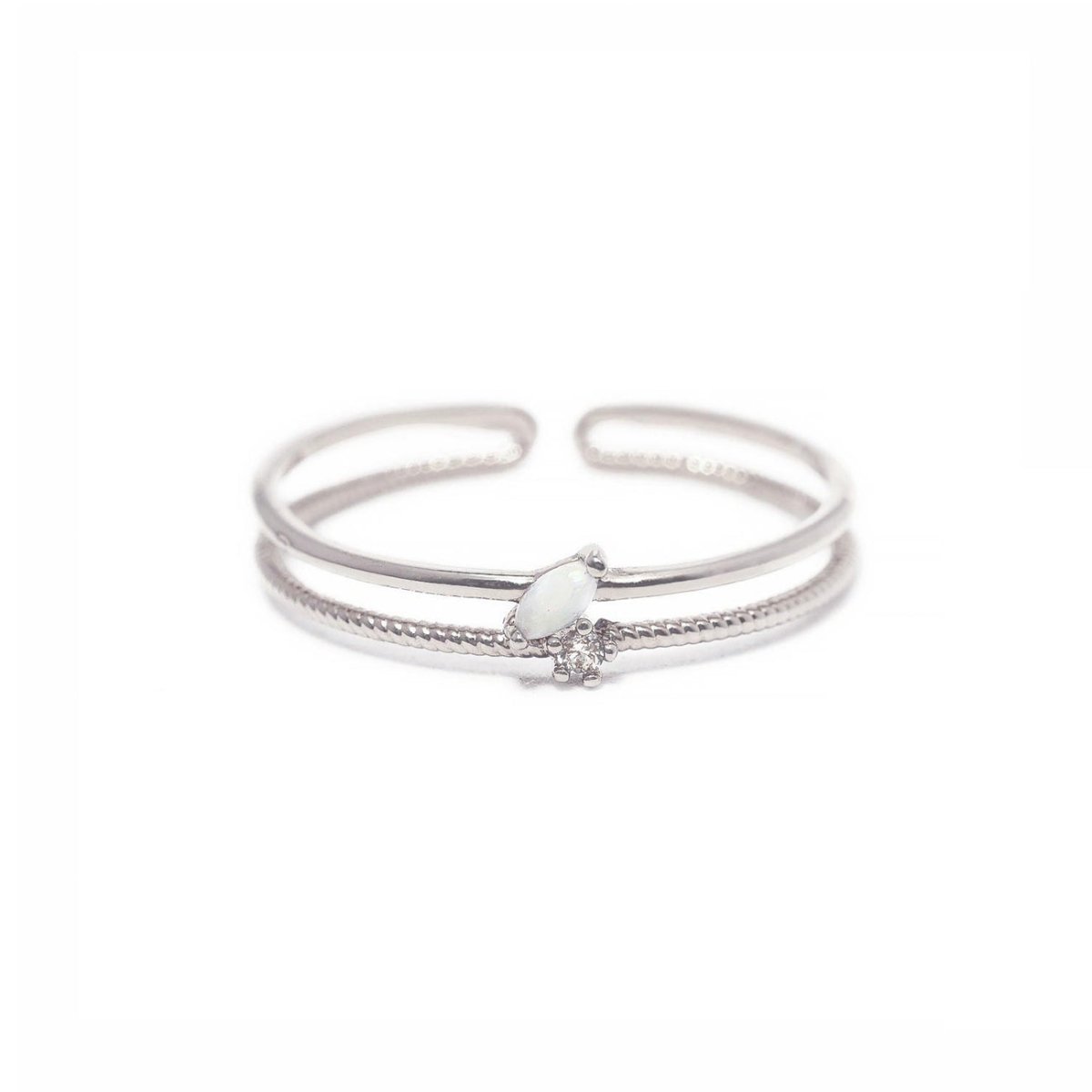 Sterling silver double band ring with an oval white opal and a round white zirconia, on a white background
