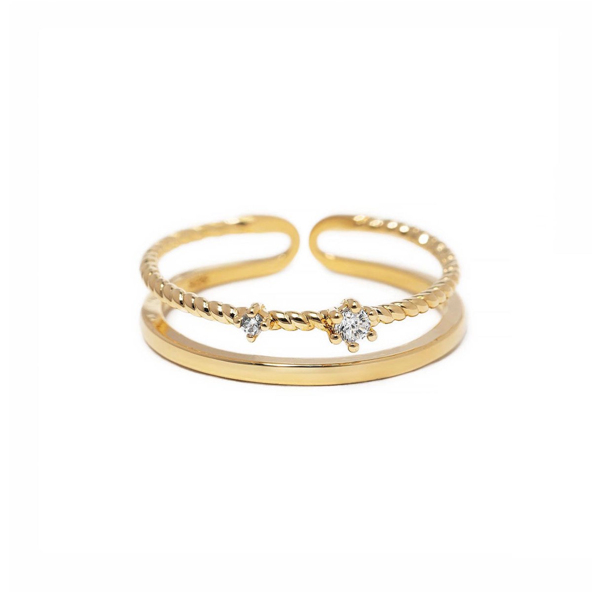 Gold vermeil rope stacking ring with prong-set white zirconia stones and an open adjustable band, on a white background