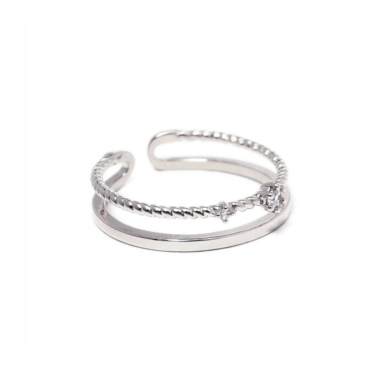 Sterling silver twisted rope stacking ring with prong-set white zirconia stones, open band, on a white background