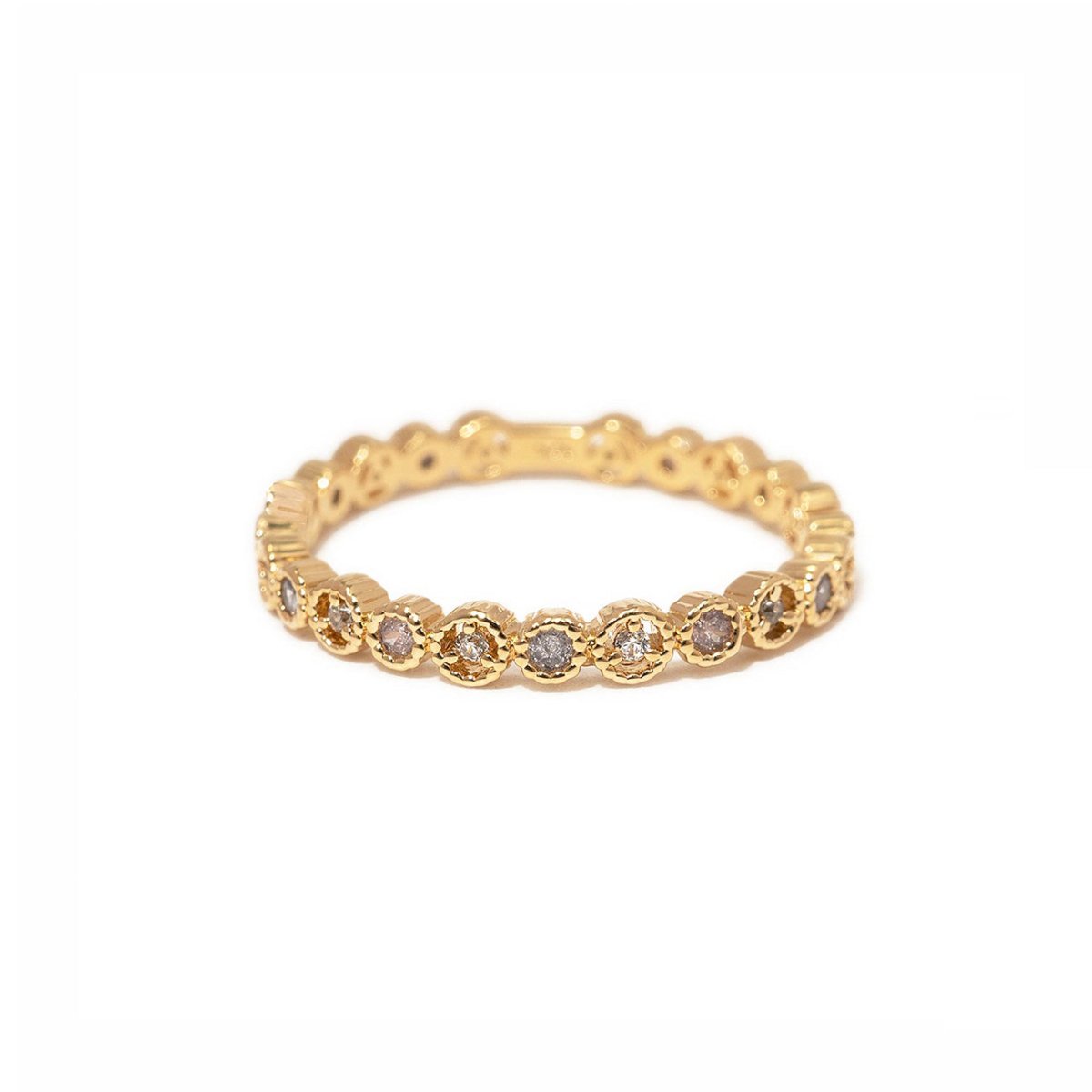 Gold vermeil eternity stacking ring with round white zirconia in a beaded setting, on a white background