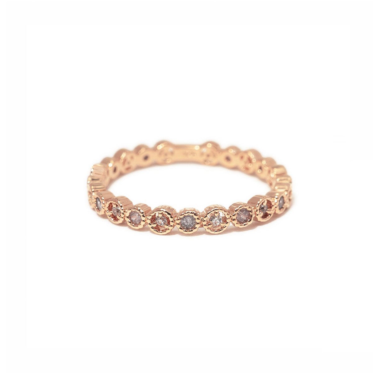 Rose gold vermeil eternity stacking ring with round white zirconia in a beaded setting, on a white background