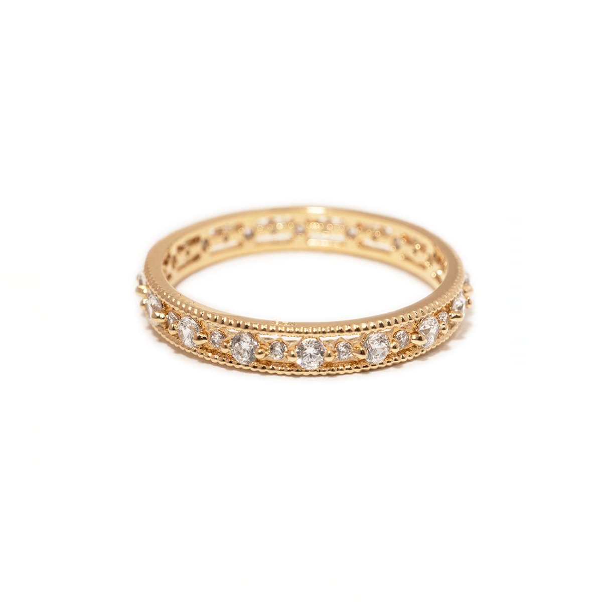 Gold vermeil eternity stacking ring set with clear white zirconia stones, on a white background