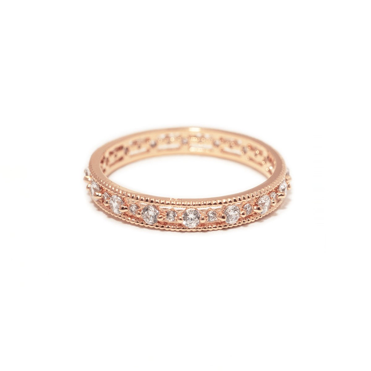 Rose gold vermeil eternity stacking ring set with clear white zirconia stones, on a white background