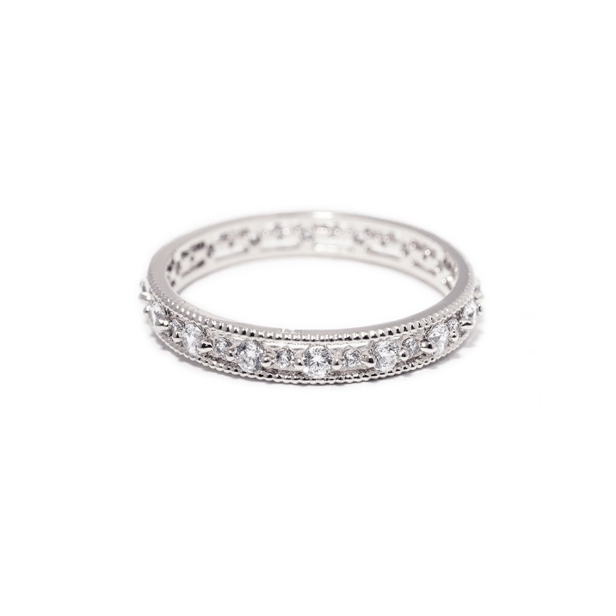 Sterling silver eternity stacking ring set with clear white zirconia stones, on a white background