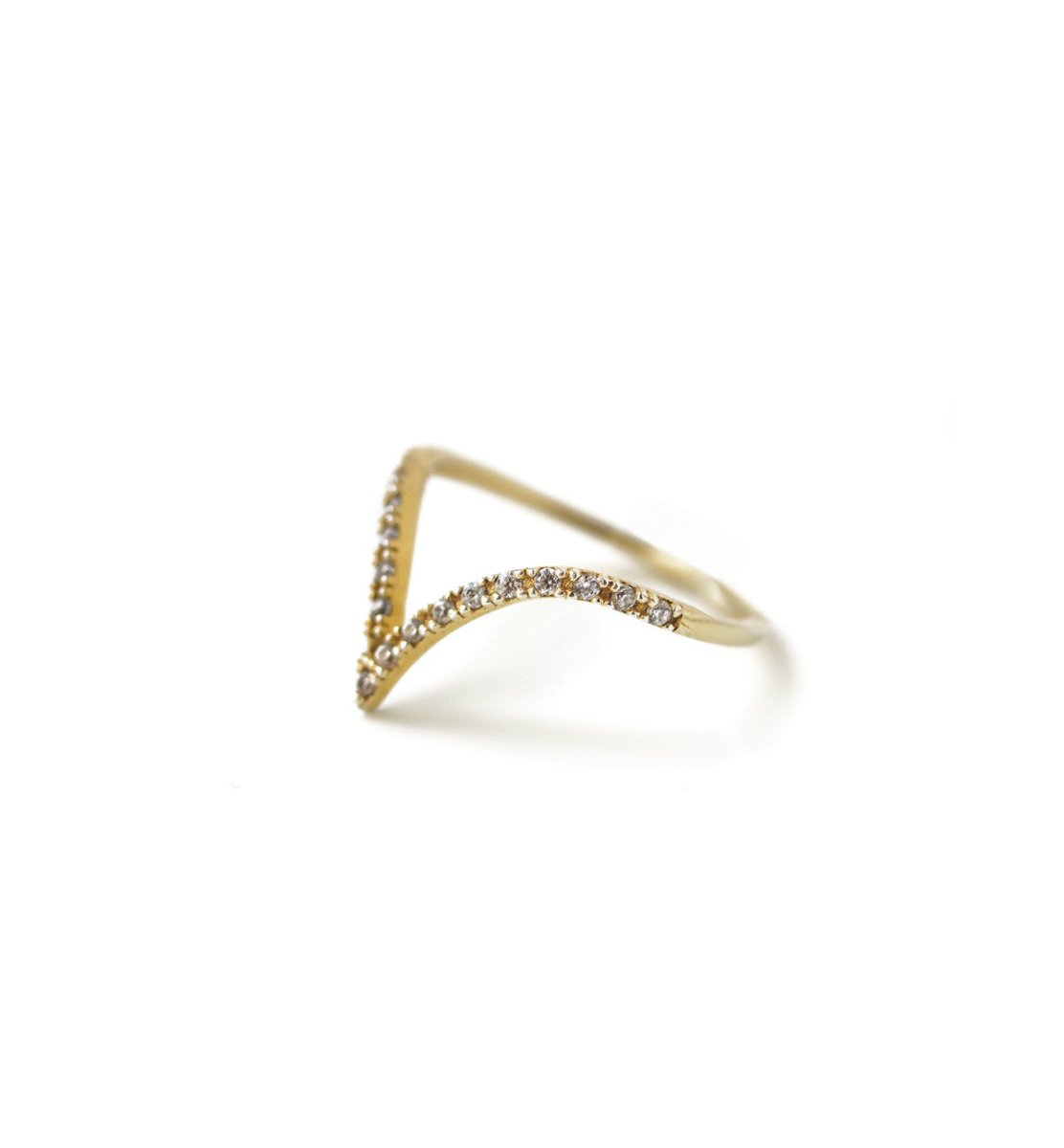 Gold vermeil pavé chevron ring with clear crystals along a V-shaped band, on a white background
