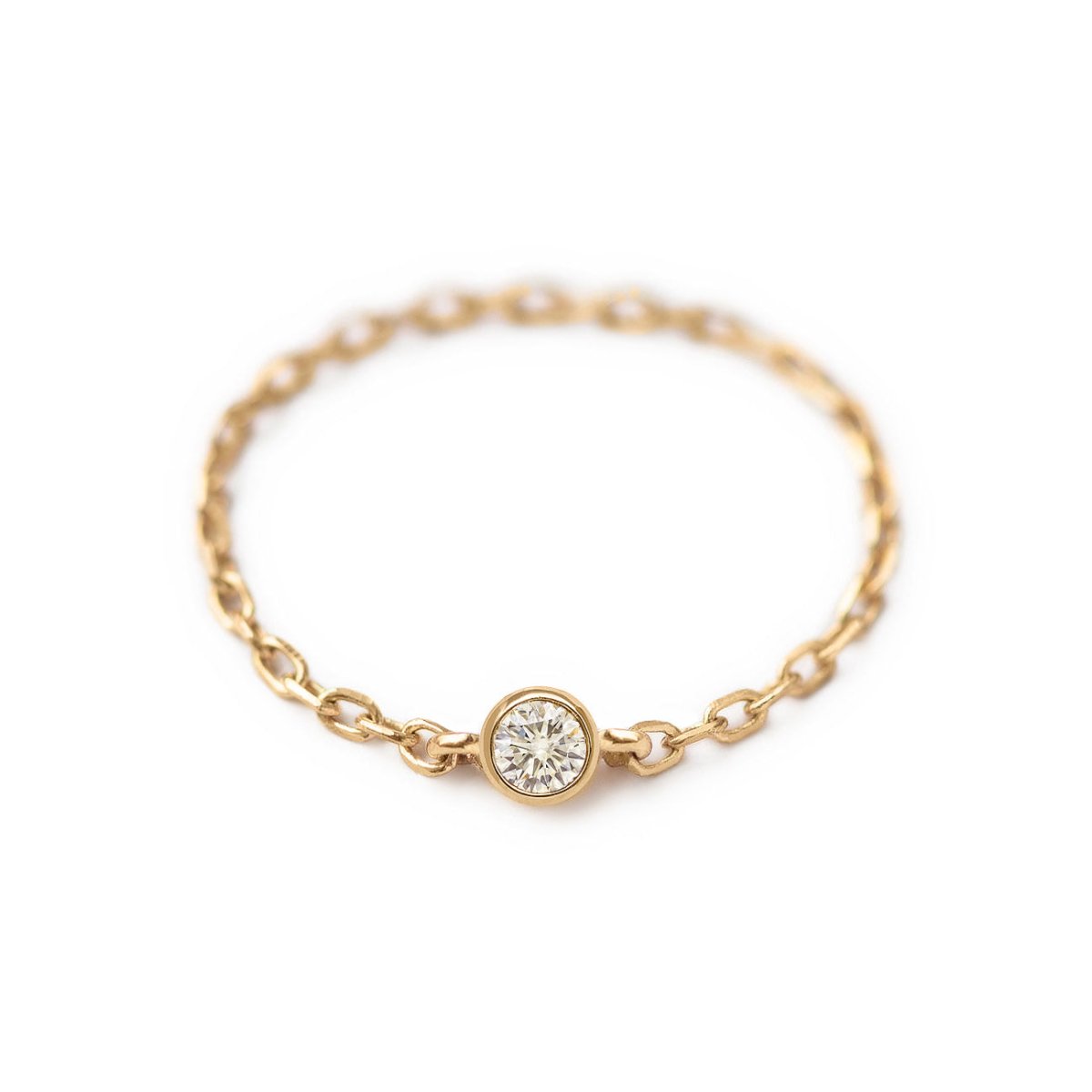 14K gold chain ring with a single bezel-set clear stone, on a white background