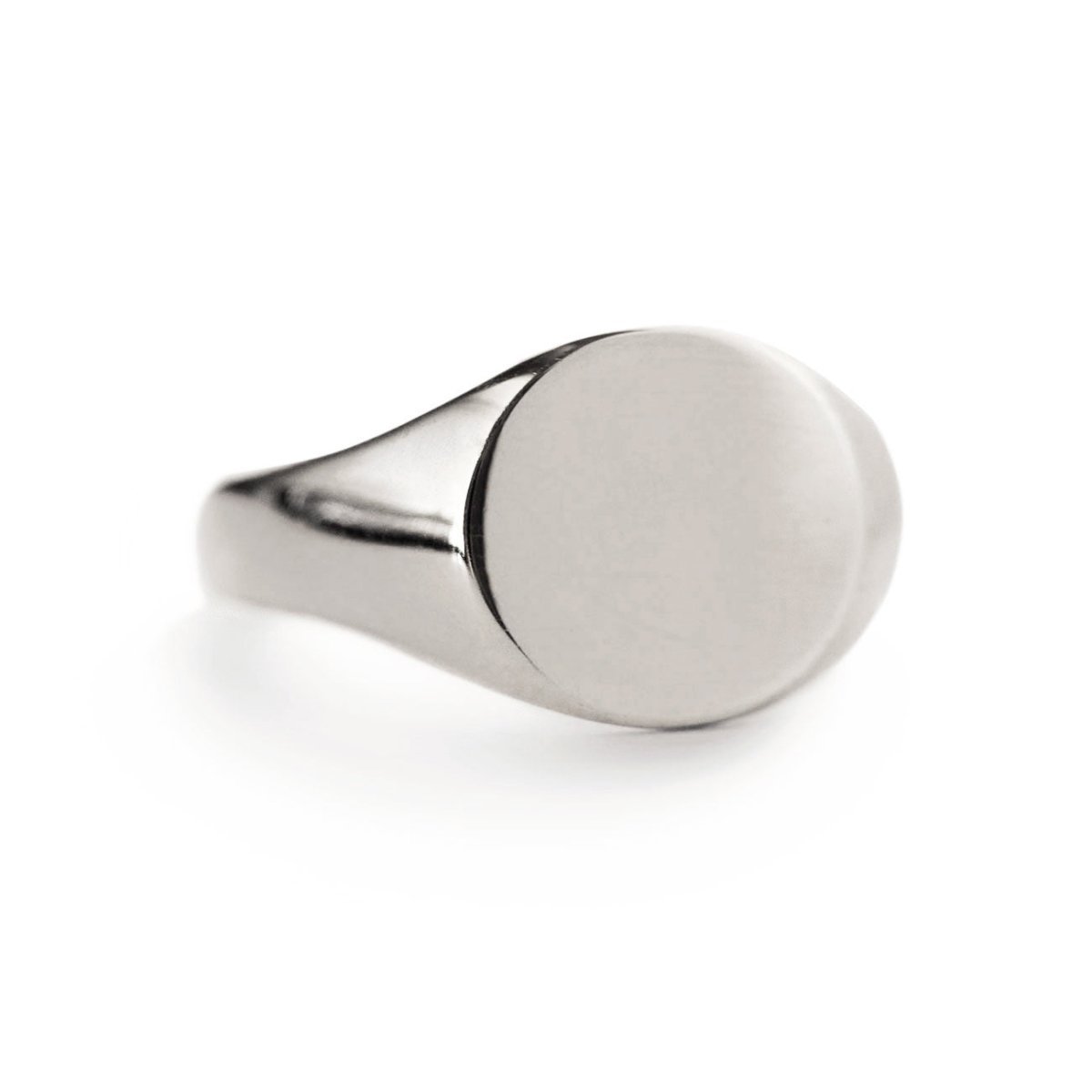 Sterling silver oval signet ring with a plain face, on a white background