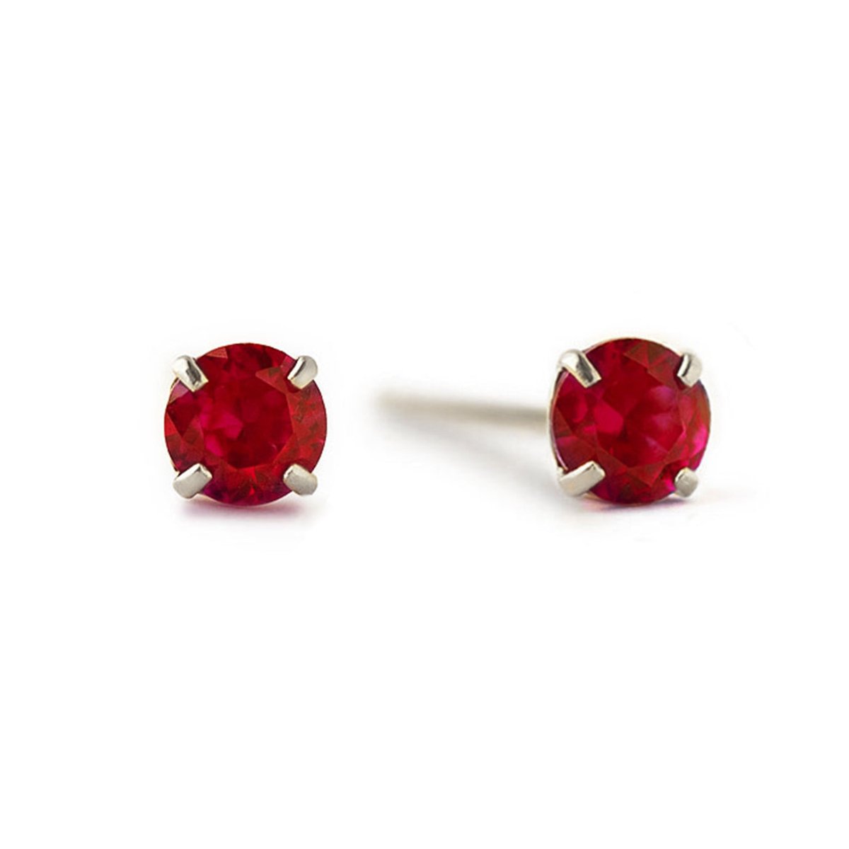 14K white gold garnet studs with round deep-red stones in four-prong settings, on a white background