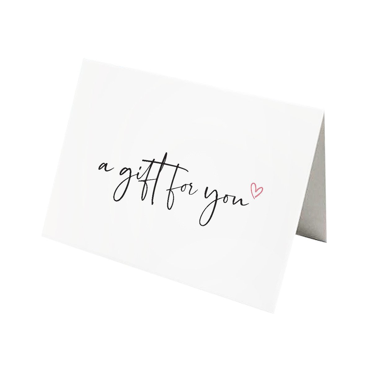 Folded white gift card with handwritten script and a small heart, on a white background