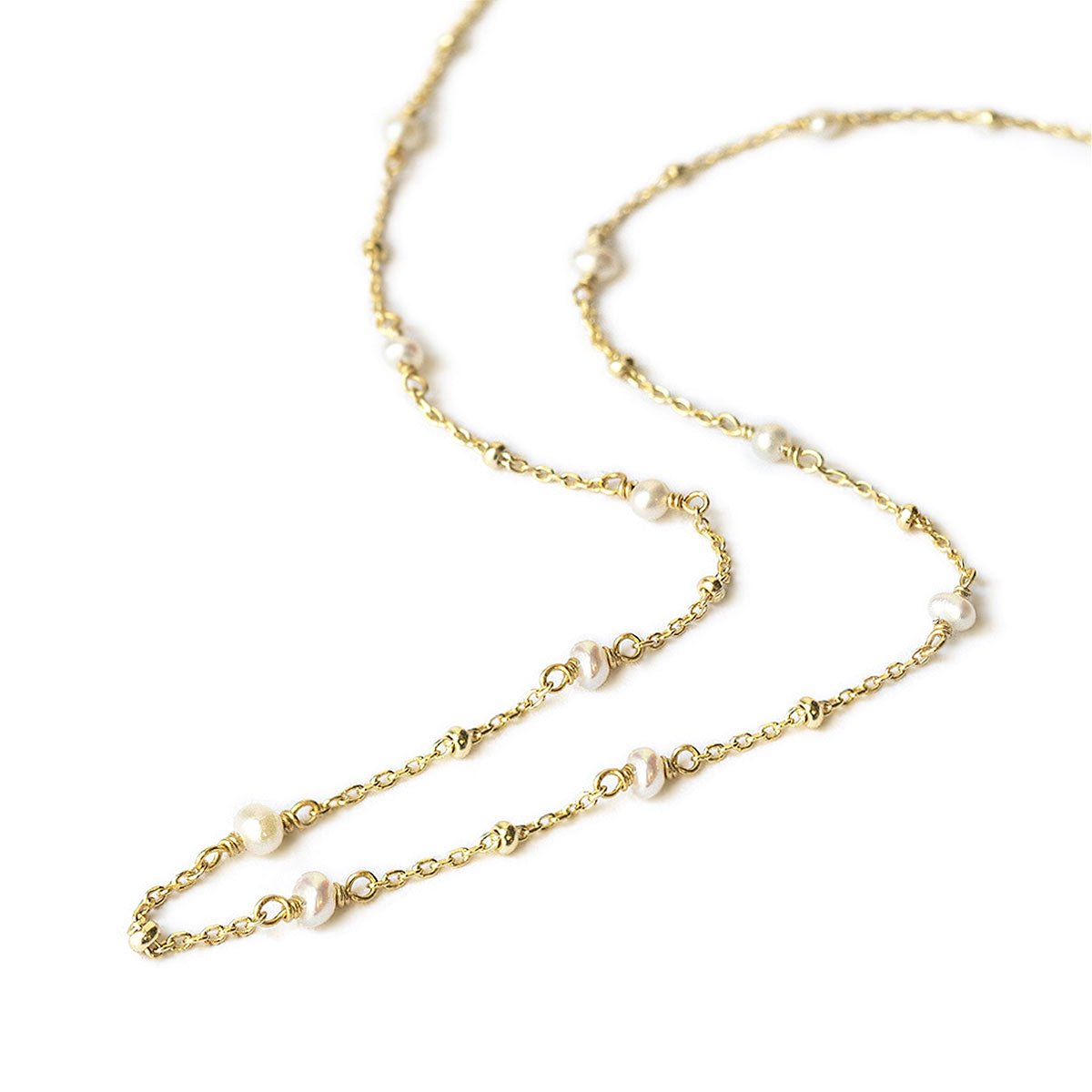 Gold vermeil pearl choker necklace, close-up detail of the small pearls along the chain, on a white background