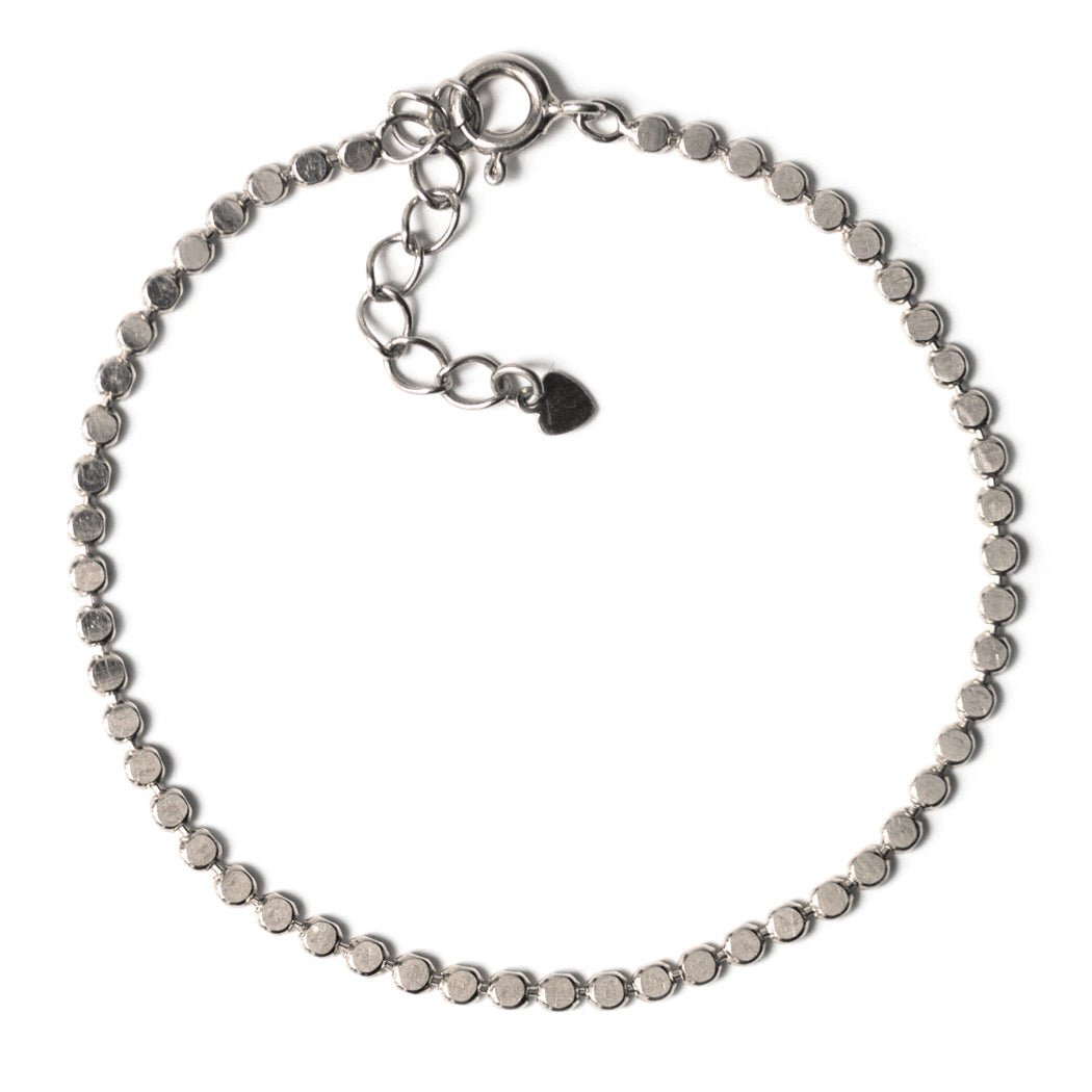 Sterling silver beaded chain bracelet with a spring-ring clasp and extender, on a white background