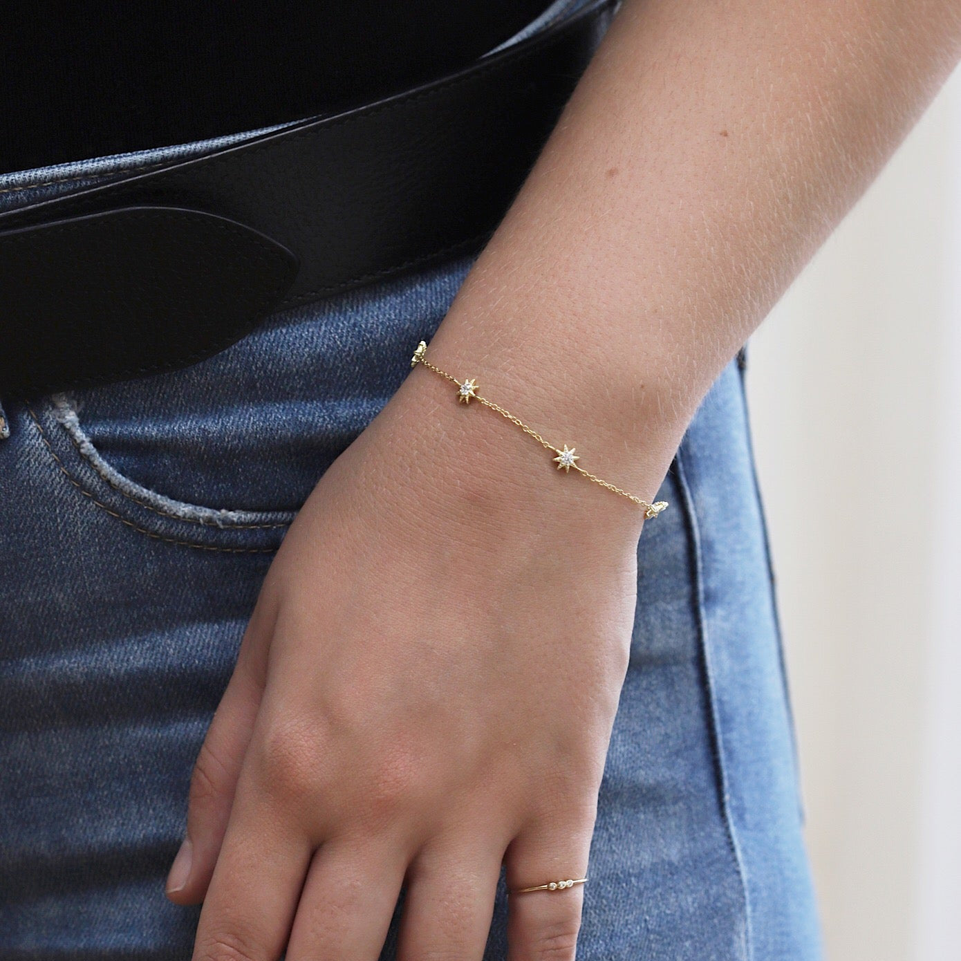 Rose gold vermeil pavé star station chain bracelet, shown on a model's wrist