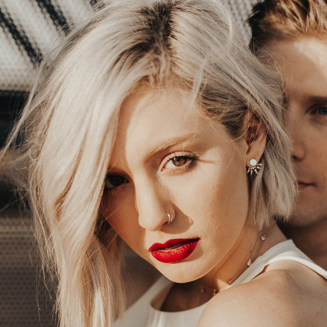 Gold vermeil spike ear jacket with white zirconia shown on a model styled with red lipstick
