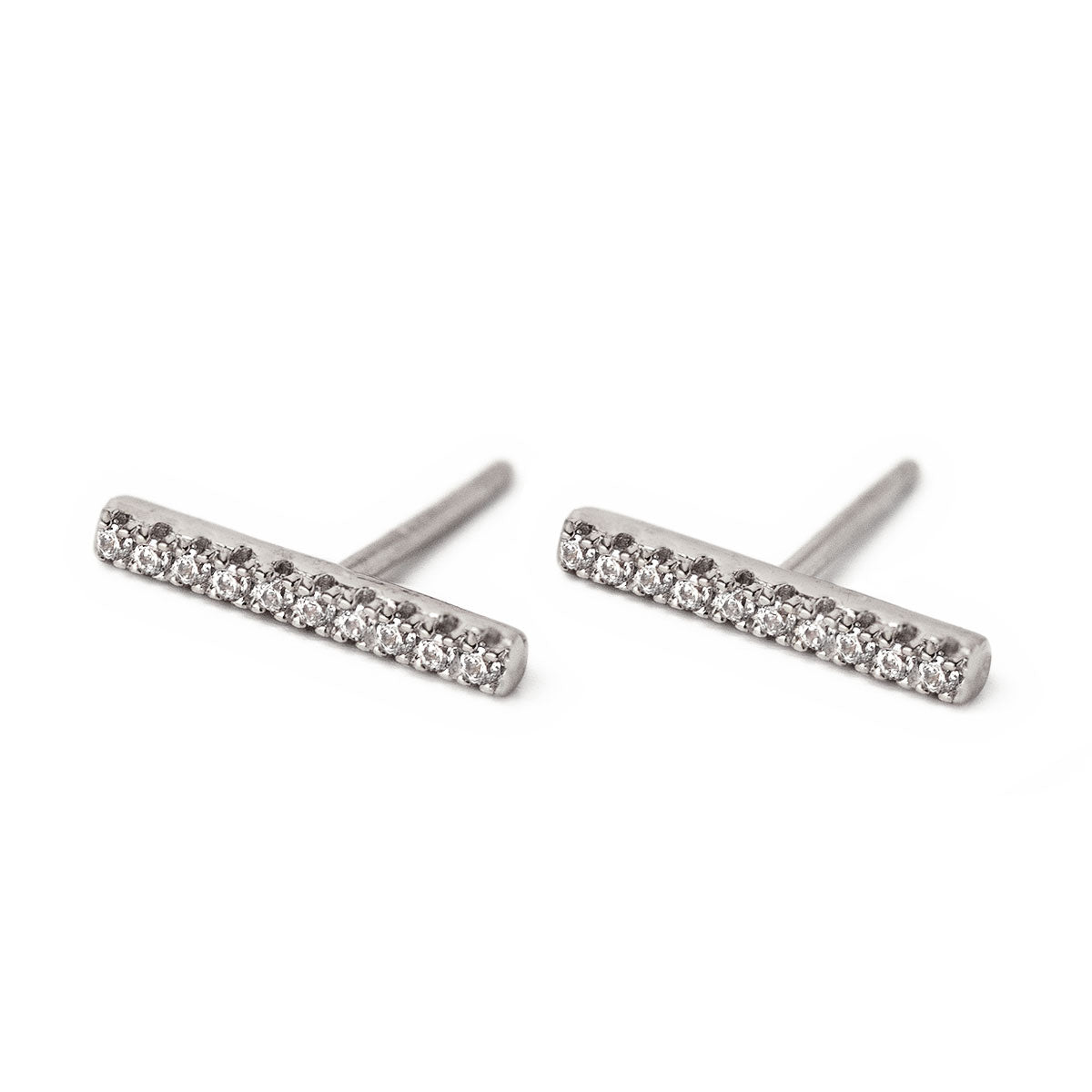 Sterling silver pave bar stud earrings set with small clear stones, on a white background