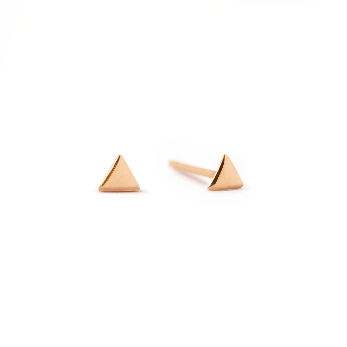 14K rose gold tiny triangle stud earrings, shown as a pair on a white background