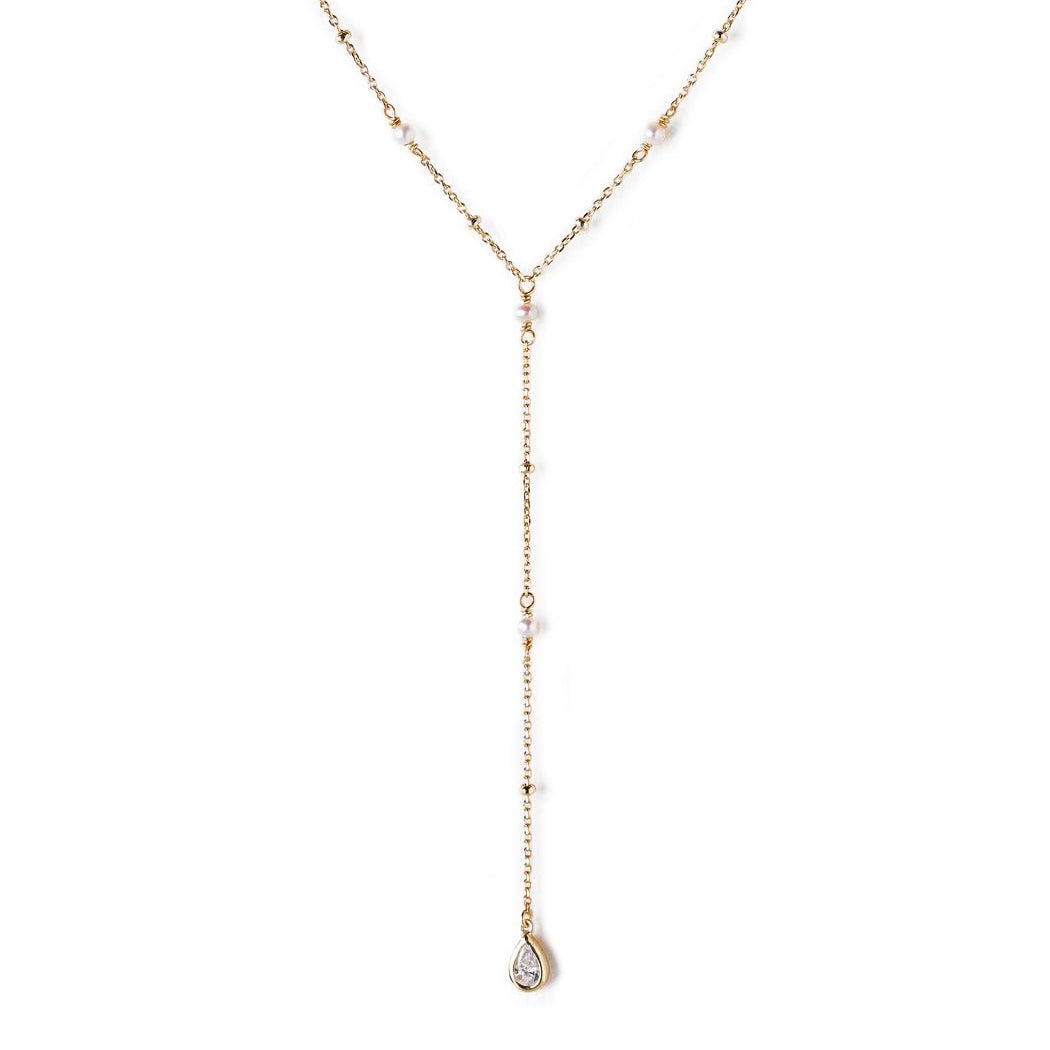 Rose gold vermeil lariat necklace with pearl stations and a teardrop drop, on a white background