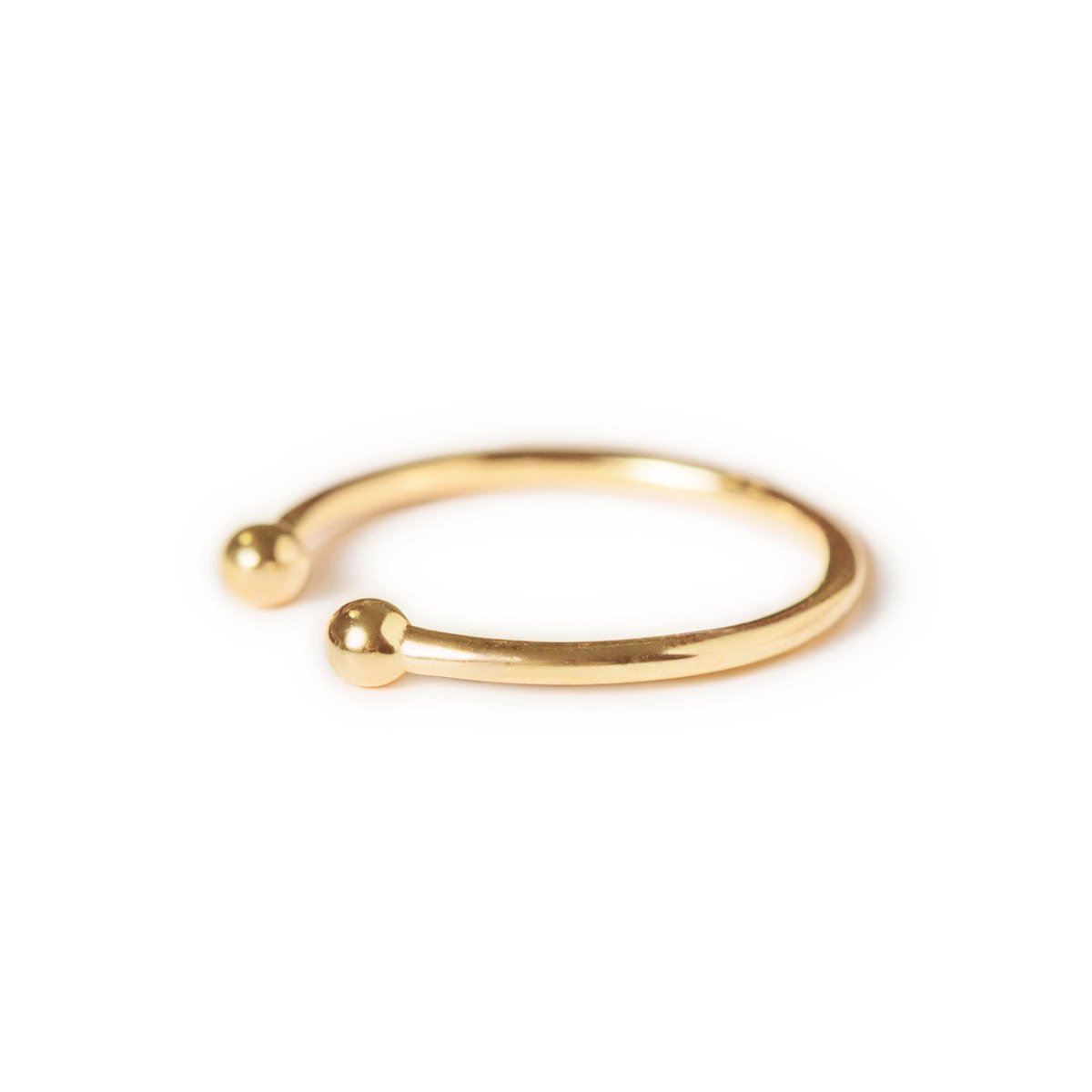 Gold vermeil open ring with ball ends, angled side view on a white background