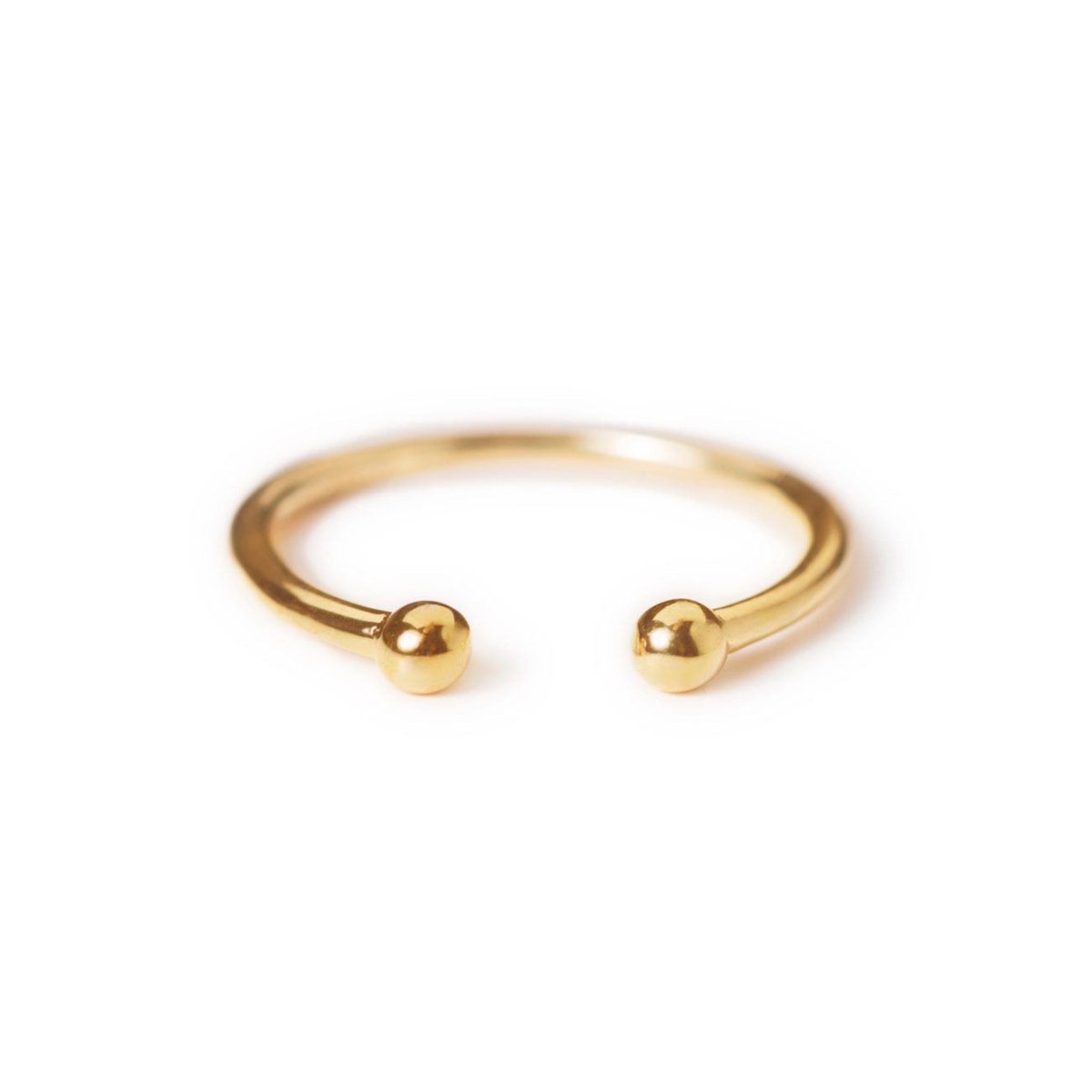 Gold vermeil open ring with two polished ball ends, on a white background